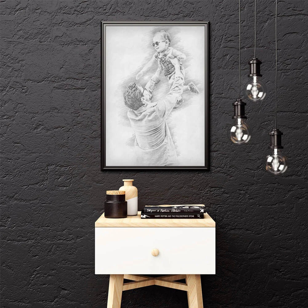 Personalised pencil portrait from photo of father lifting baby, framed in black A4, new dad and family gift designed in the UK
